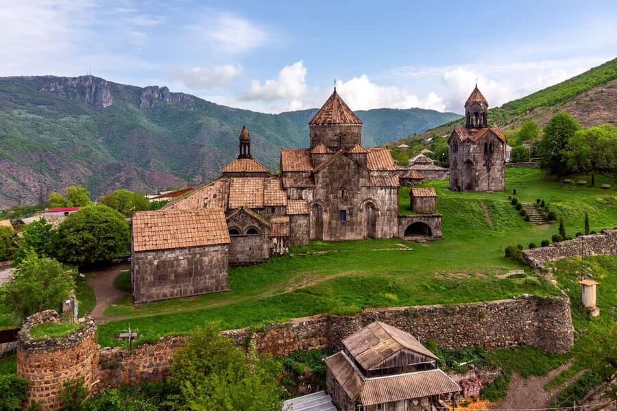 Tbilisi to Armenia Sanahin Akhtala Haghpat Group Day Tour - Akhtala Monastery joins frescoes with fortress walls